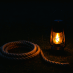 In twilight, a light can be a helpful tool to see a coiled rope.